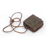 Tibetan bronzed shrine box embossed with flowers, 11cm high