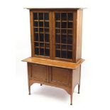 Liberty & Co, Arts & Crafts oak glazed bookcase on stand with adjustable shelves, 169cm H x 108cm