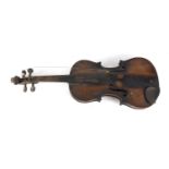 Old wooden violin with scrolled neck, the violin back 14 inches in length