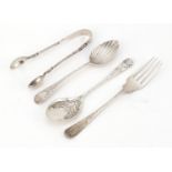 Georgian and later silver cutlery including apostle sugar tongs a teaspoon with shell shaped bowl,