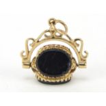 9ct gold hardstone spinner fob set with black onyx, bloodstone and carnelian, 2cm high, 3.0g
