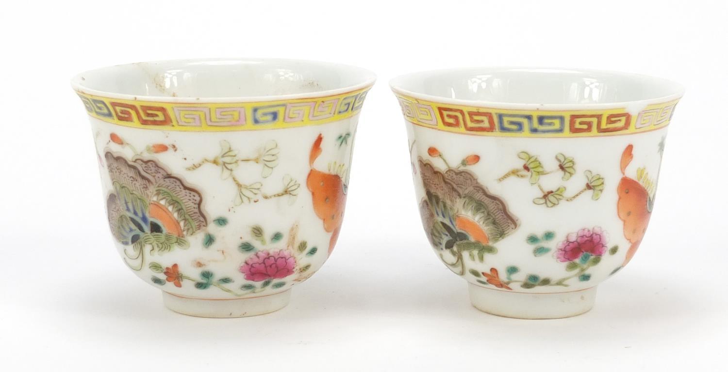 Pair of Chinese porcelain tea cups, each finely hand painted in the famille rose palette with - Image 4 of 10