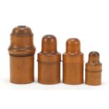 Four 19th century treen bottle holders, the largest 14.5cm high