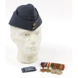 British military World War II four medal group and a side cap