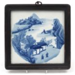 Chinese blue and white porcelain panel housed in a hardwood frame, hand painted with two figures