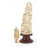 Two Indian ivory carvings including a large example of Ganesh, raised on a wood plinth base, the