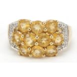 9ct gold orange stone cluster ring with diamond shoulders, size O, 4.6g
