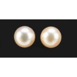 Pair of 18ct gold pearl stud earrings with 14ct gold backs, 7mm in diameter, 1.5g