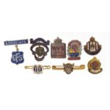 Eight vintage badges including WVS Civil Defence and National Savings