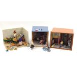 Three hand built wooden doll's house shop dioramas comprising a grocery cart with contents, train