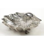 Atkin Brothers, large Victorian silver shell shaped bowl embossed with flowers and raised on three