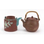 Two Chinese Yixing terracotta teapots including one enamelled with a bird and flowers, with
