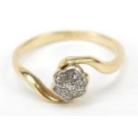 Unmarked gold diamond flower head crossover ring, size J, 2.1g