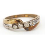9ct gold cubic zirconia crossover ring, size N, 1.6g