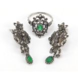 Antique style unmarked silver ring and earrings set with green and clear stones, the ring size Q,