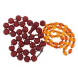 Two amber coloured bead necklaces, 150.8g
