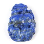 Chinese lapis lazuli pendant carved with a dragon, 6.5cm in length