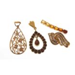 Four 9ct gold pendants set with stones including diamonds, garnets and citrine, the largest 3cm