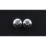 Pair of 18ct white gold diamond stud earrings, 4mm in diameter, 1.0g