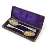 Pair of Victorian silver plated berry spoons housed in a velvet and silk lined box, each 22cm in