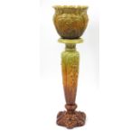 Leeds Art Pottery, Arts & Crafts jardinière on stand, decorated in relief with stylised flowers, the