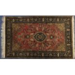 Rectangular Persian Qum silk rug having all over floral design, 171cm x 108cm