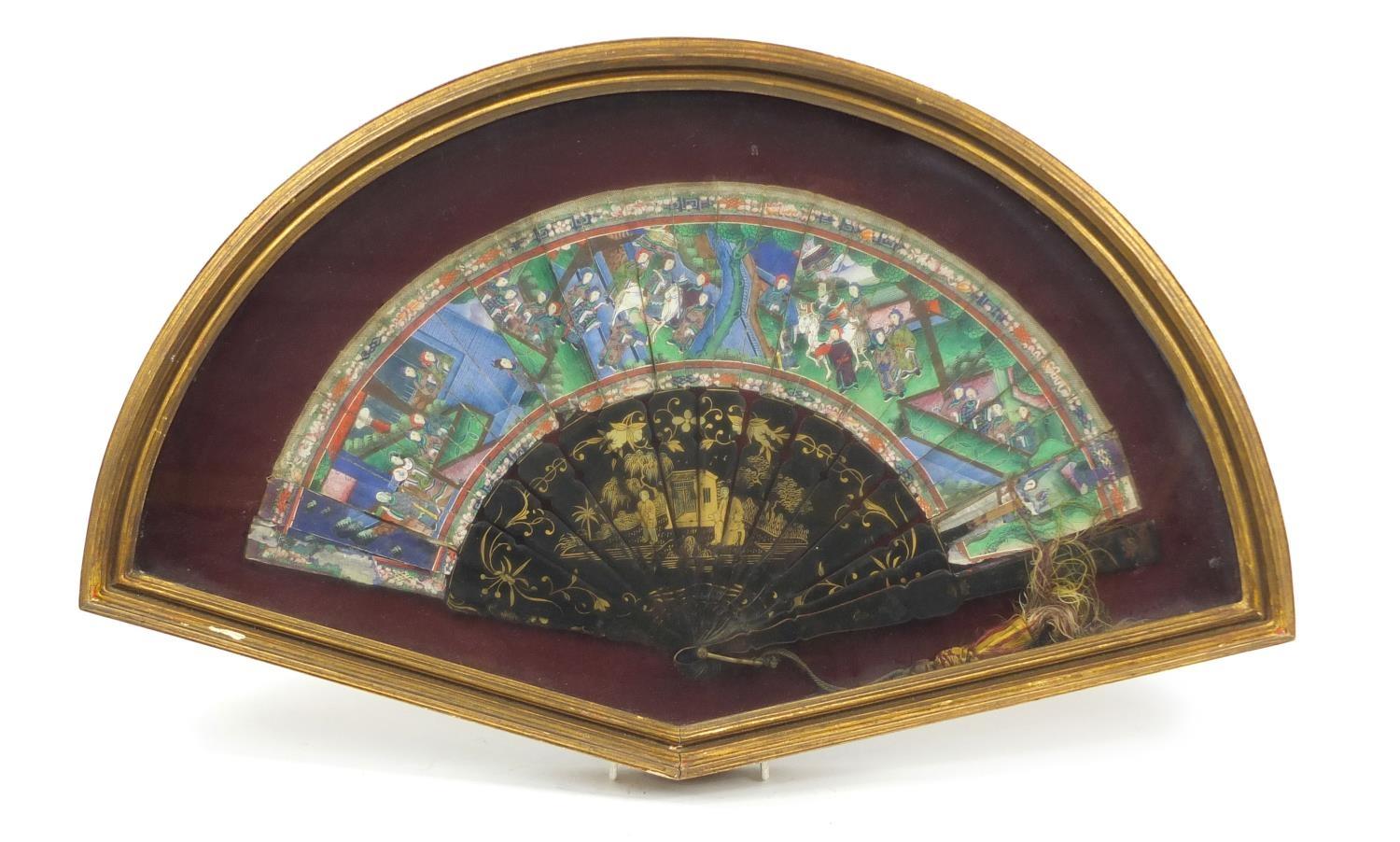 Chinese brisé fan with black lacquered sticks and guards, hand painted and gilded with figures in