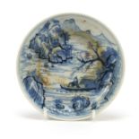 Chinese blue and white porcelain shallow dish hand painted with fishermen in a mountain landscape,