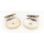 Andreas Mikkelsen for Georg Jensen, pair of Danish silver and 18ct gold cufflinks, pattern number