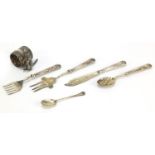 Silver and white metal objects including a silver teaspoon and silver handled cutlery