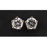 Pair of unmarked white gold diamond solitaire stud earrings with screw backs, 4.2mm in diameter, 1.