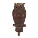Black Forest musical carved owl clockwork coat hook with beaded eyes, 28cm high