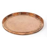 Newlyn, Arts & Crafts circular copper galleried tray embossed with apples and leaves, impressed