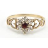 9ct gold garnet and cubic zirconia flower head ring with pierced love heart shoulders, size M, 1.2g