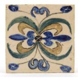 Attributed to Bernard Leach, St Ives studio pottery tile, hand painted with a stylised floral