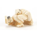 Japanese carved ivory okimono of an erotic couple, 5cm in length