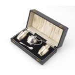 Silver three piece cruet housed in a velvet and silk lined fitted case, L.DLD Birmingham 1969, the