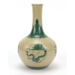 Chinese porcelain vase hand painted in green with roundels of dragons below a ruyi head border,