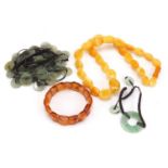 Jade and amber coloured jewellery comprising two necklaces and two bracelets
