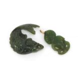 Two spinach green jade carvings including a Maori example, the largest 3cm high