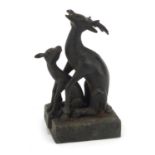 Chinese patinated bronze two piece seal in the form of a deer and foal, character marks to the base,