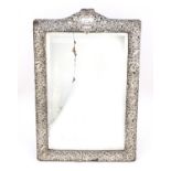 Henry Matthews, Edward VII silver easel mirror profusely embossed with birds amongst foliage,