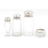 Three cut glass sifters with silver lids and a salt with silver collar, various hallmarks, the