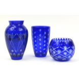 Three Bohemian blue flashed cut glass vases, the largest 26cm high