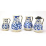Four Victorian aesthetic jugs decorated with stylised flowers, each with lozenge marks to the