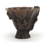 Chinese libation cup carved with dragons, character marks to the base, 11.5cm high