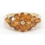 9ct gold orange stone flower head ring, size O, 2.9g