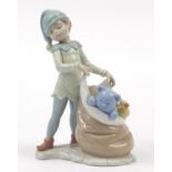 Lladro, Santa's Magical Workshop figure of an elf with sack of toys, with box and paperwork,