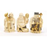 Three Japanese carved ivory netsukes of Elders, each with character marks to the bases, the