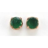 Pair of unmarked gold green stone earrings, possibly emerald, 4.2mm in diameter, 1.0g